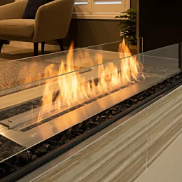 EcoSmart Fire Flex 50DB Flex Fireplace divides open-plan private residence, built-in double-sided bioethanol design delivering modern ventless warmth.