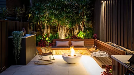 EcoSmart Fire Mix 850 Fire Pit enhances a Stone Lotus Landscapes patio with sustainable outdoor heating for residential spaces.