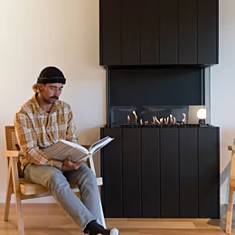 EcoSmart Fire Flex 32BY Flex Fireplace delivers efficient residential heating to EcoHut with a sleek built-in ethanol fireplace.
