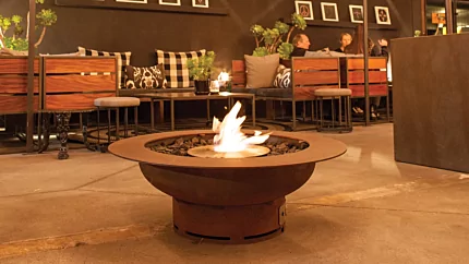 EcoSmart Fire AB8 Ethanol Burner built into an outdoor bar at The Farmer’s Daughter USA providing ventless bioethanol warmth.