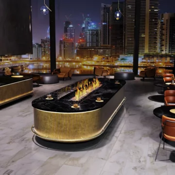 EcoSmart Fire Linear 90 Fire Pit Kit recessed on a commercial balcony, clean‑burning outdoor ethanol fireplace for modern ambience.