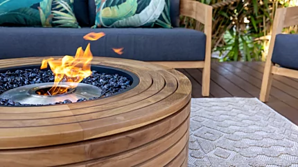 Ark 40 Fire Table by EcoSmart Fire enhances Outdoor Elegance’s residential deck with a contemporary teak ethanol fireplace installation.