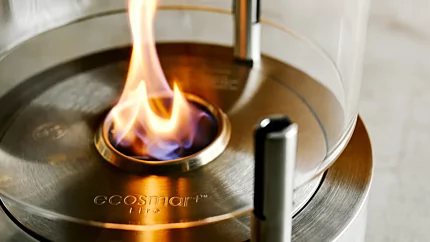 EcoSmart Fire T-Lite Series Designer Fireplace detail shows ventless bioethanol flame in a freestanding tabletop burner for a private residence.