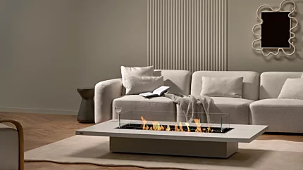 EcoSmart Fire Daiquiri 70 Fire Table delivers clean ethanol warmth in a bone concrete living room, serving as a sleek central hearth.