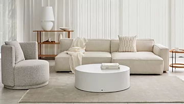 Blinde Design Circ 40 concrete coffee table anchors a private living room, offering a sleek round centrepiece for contemporary interior style.