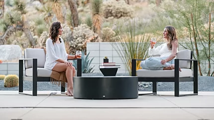Blinde Design Circ 40 concrete coffee table grounds Private Residence patio in Starfire project, delivering durable outdoor furniture focal point.