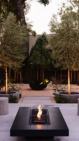 EcoSmart Fire Gin 90 Low Fire Table installed outdoors at a private residence delivers luxurious warmth and style with advanced gas technology.